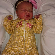 Delilah joined the competition — help win amazing prizes! baby, bed, bedroom, blanket, clothing, crib, cushion, face, furniture, glove, head, homedecor, indoors, infantbed, newborn, person, photography, portrait, room, sleeping