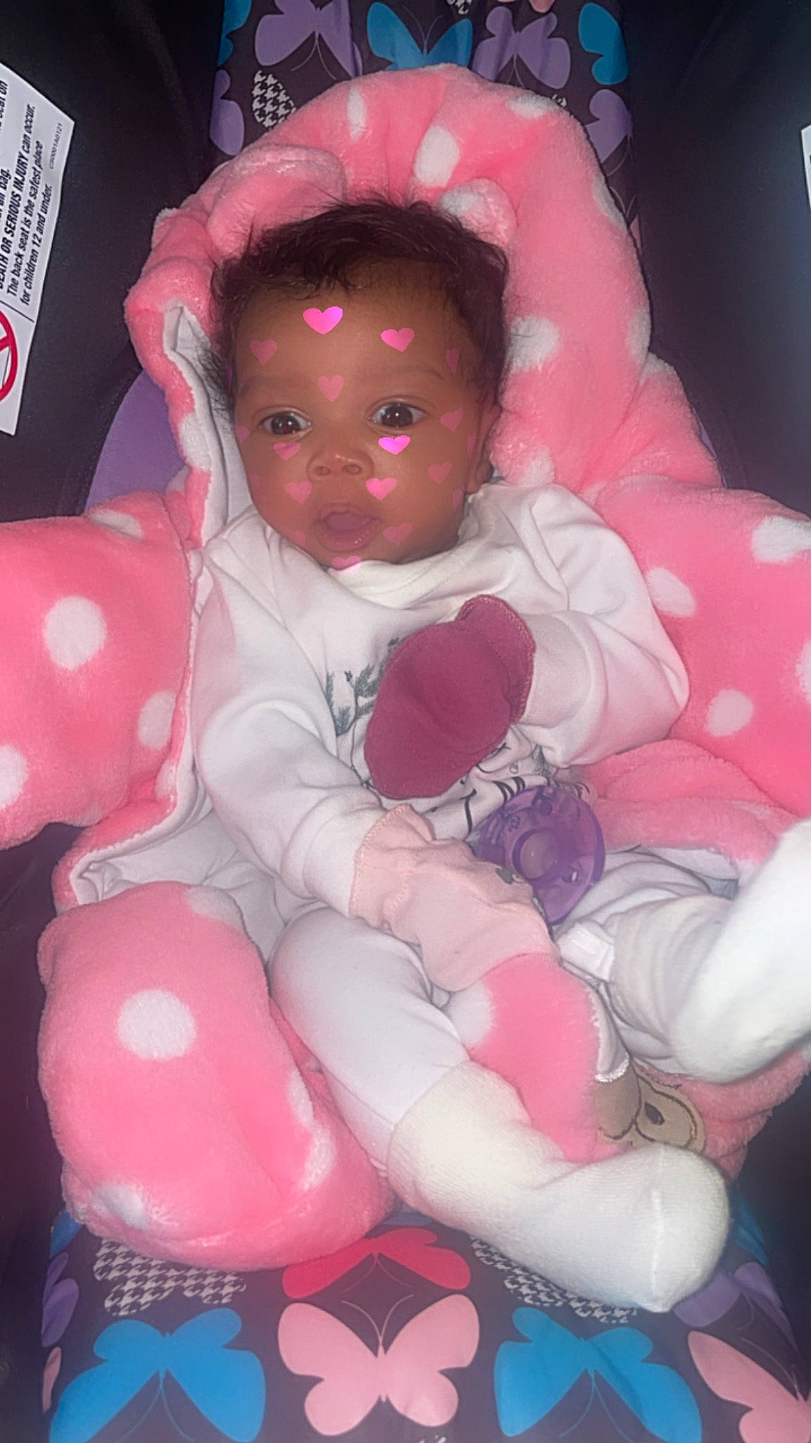 Laia is registered to the contest to win money with this photo: baby, baby_products, baby_toddler_clothing, baby_toys, carmine, cheek, child, comfort, doll, lap, magenta, person, pink, sitting, toddler, toy, white