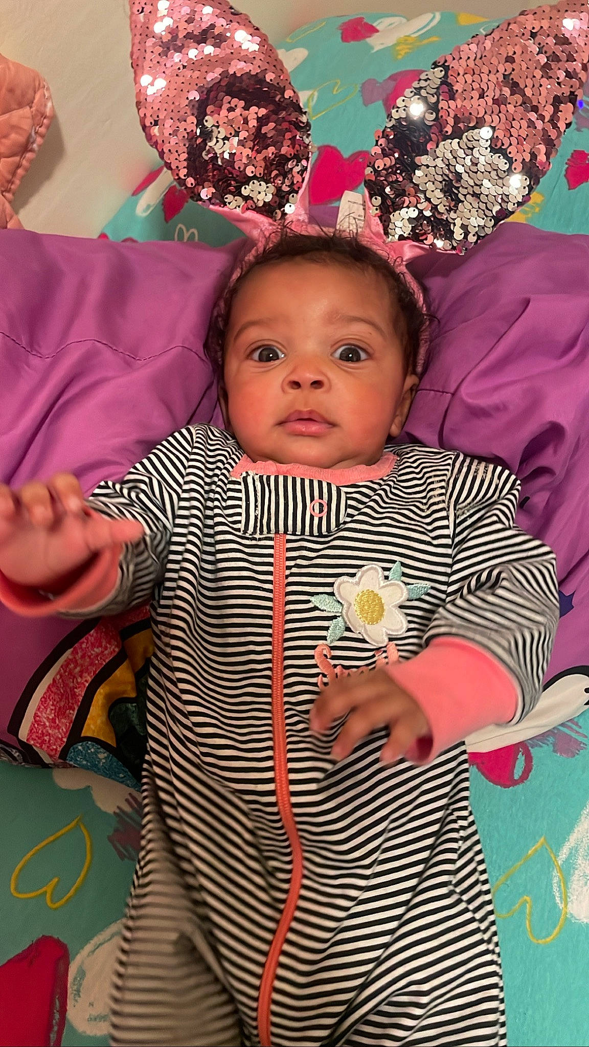 Laia is registered to the contest to win money with this photo: baby, baby_toddler_clothing, cheek, child, event, eye, face, facial_expression, fun, hairstyle, happy, head, iris, magenta, organ, people, person, pink, skin, textile