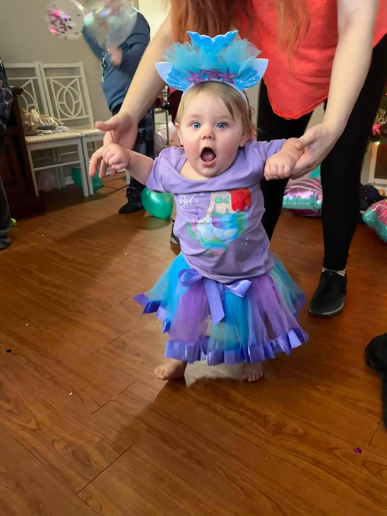 Deanna is registered to the contest to win money with this photo: baby_toddler_clothing, child, entertainment, event, floor, flooring, fun, happy, hardwood, laminate_flooring, leisure, performing_arts, person, pink, purple, smile, surprise, toddler, violet, wood