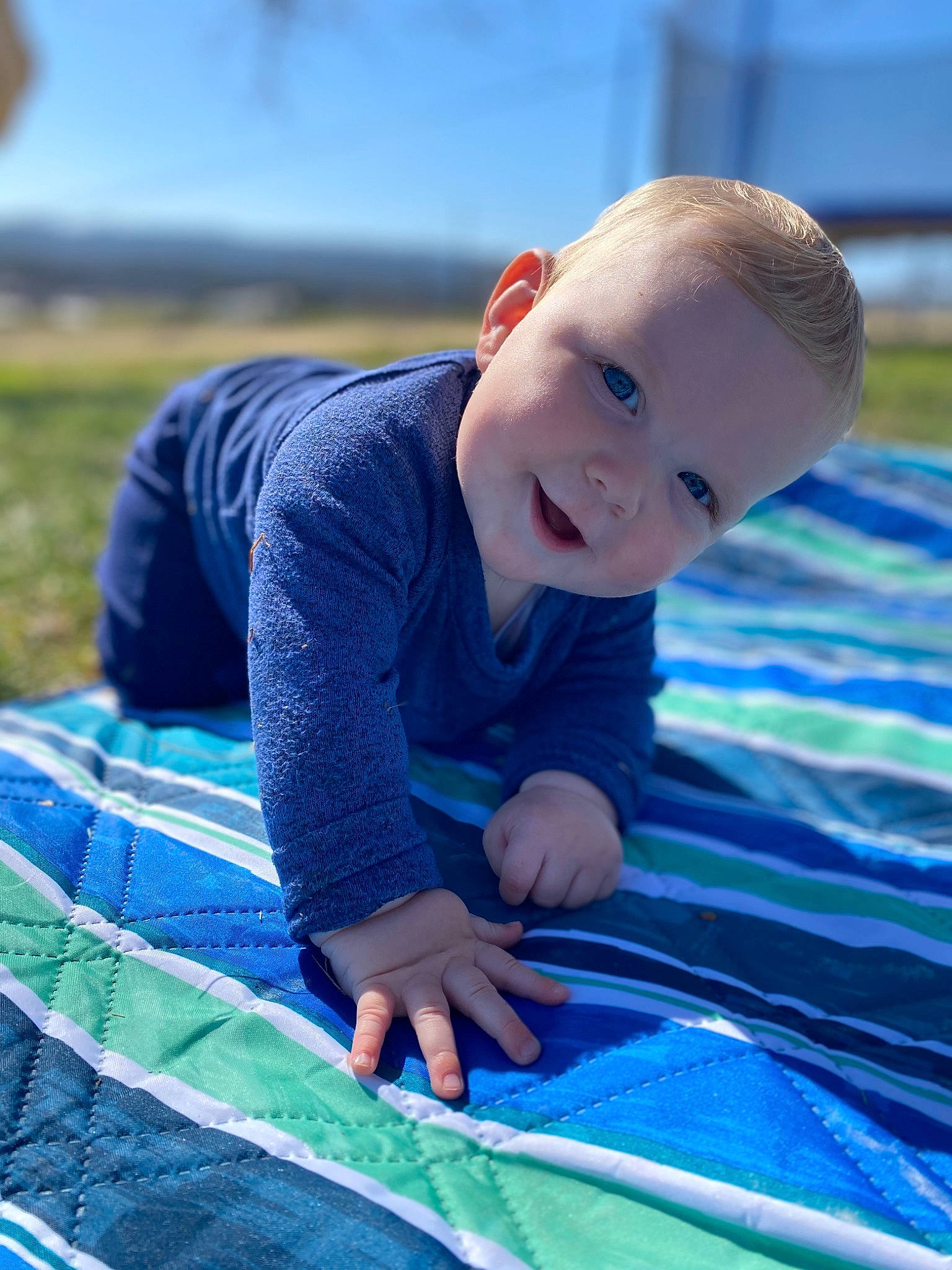 Zephyr joined the competition — help win amazing prizes! azure, baby, baby_toddler_clothing, child, electric_blue, eye, flooring, fun, grass, happy, leisure, pattern, people_in_nature, person, recreation, sitting, sky, smile, toddler, vertebrate