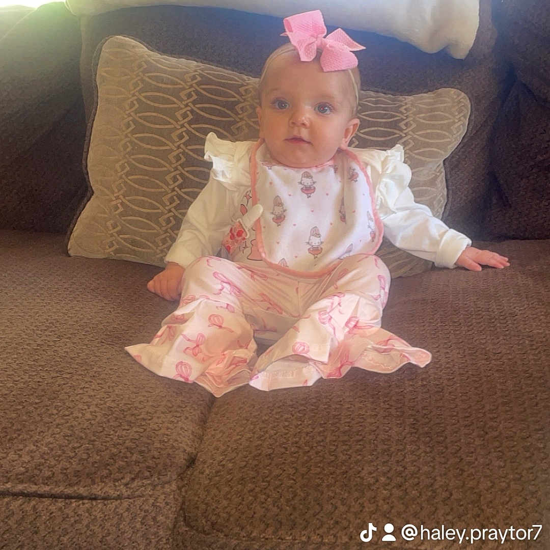 Harper is registered to the contest to win money with this photo: architecture, baby, building, clothing, costume, couch, cushion, dress, face, fashion, formalwear, furniture, gown, hat, head, homedecor, indoors, person, photography, portrait