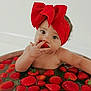 Peyton joined the competition — help win amazing prizes! baby, child, red_bow, headband, strawberries, water, tub, fruit, cute, chubby_cheeks, munching, curious_eyes, skin, hand, arm, indoor, closeup, portrait, infant, playful