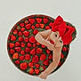 Peyton is registered to the contest to win money with this photo: baby, strawberries, red_bow, water, container, cute, child, fruit, munching, curious, minimalistic, bright, skin, headwear, sitting, food, fresh, healthy, summer, playful