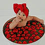 baby, child, strawberries, red_bow, headband, bucket, water, fruit, cute, indoors, portrait, skin, hand, sitting, food, fresh, healthy, playful, sweet, innocent