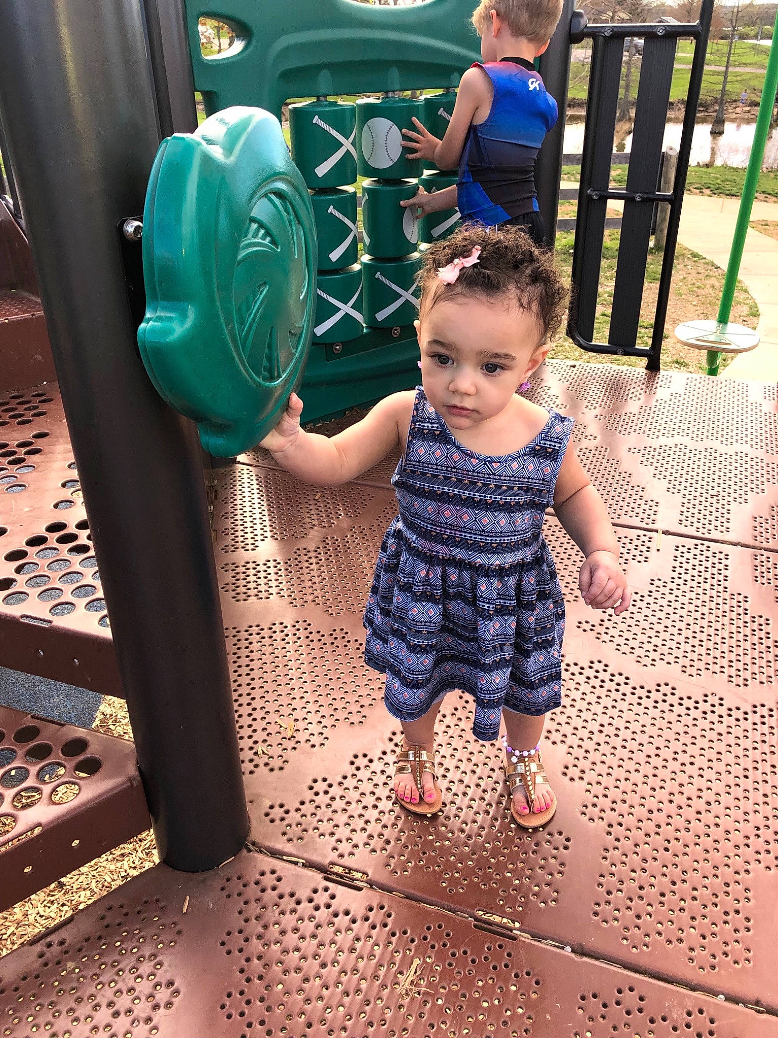 Kamille is registered to the contest to win money with this photo: baby, child, fun, green, outdoor_play_equipment, person, play, playground, public_space, recreation, smile, summer, toddler, vacation