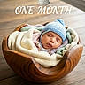 baby, newborn, sleeping, knit_hat, blanket, wooden_bowl, wooden_table, cozy, infant, portrait, cute, celebration, milestone, indoor, peaceful, child, soft_lighting, baby_clothing, headwear, wrapped