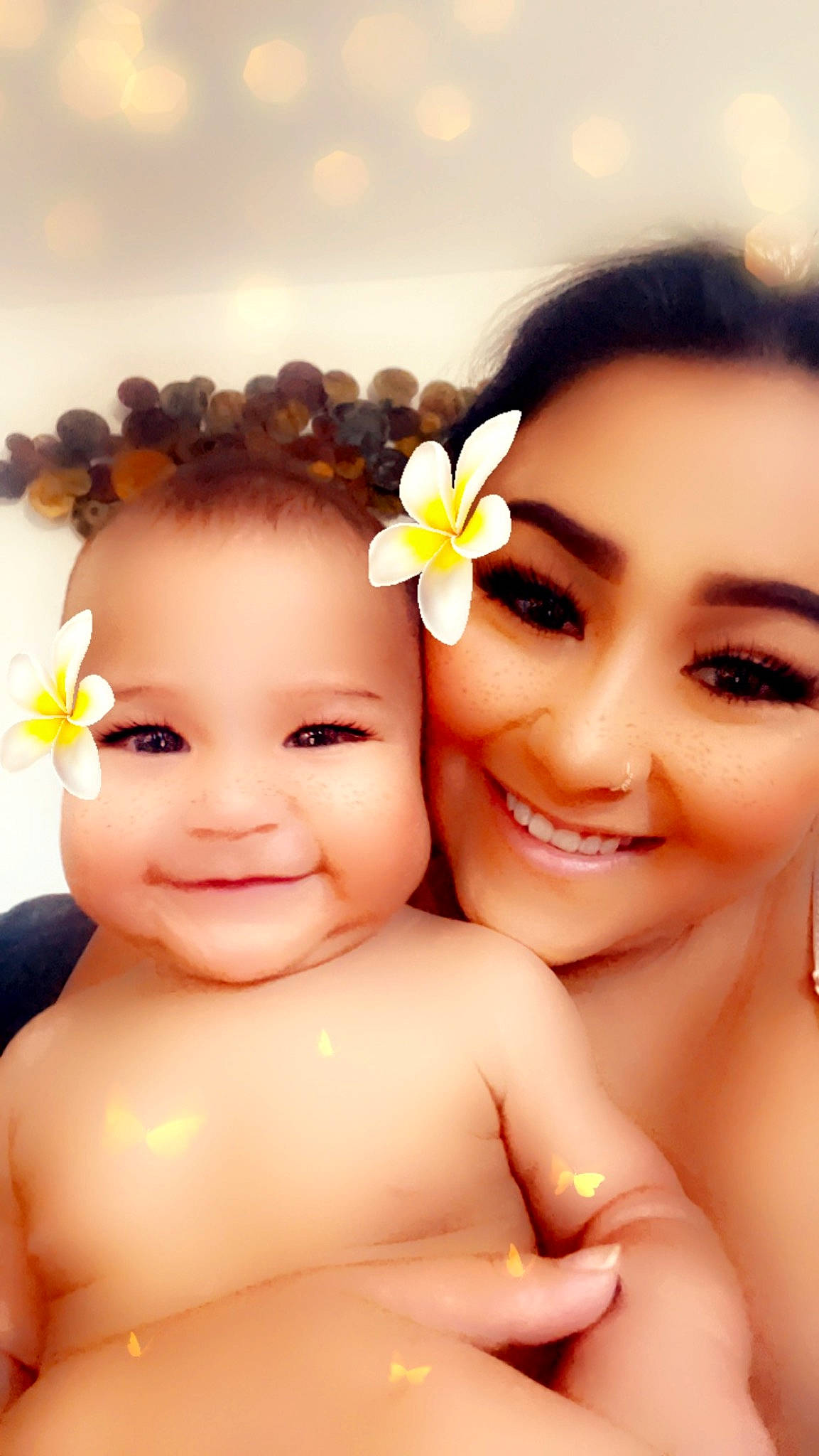 Alaïa is registered to the contest to win money with this photo: baby, black_hair, cheek, chin, eyelash, finger, flash_photography, flower, fun, gesture, happy, joy, lip, nail, people_in_nature, person, petal, plant, skin, smile