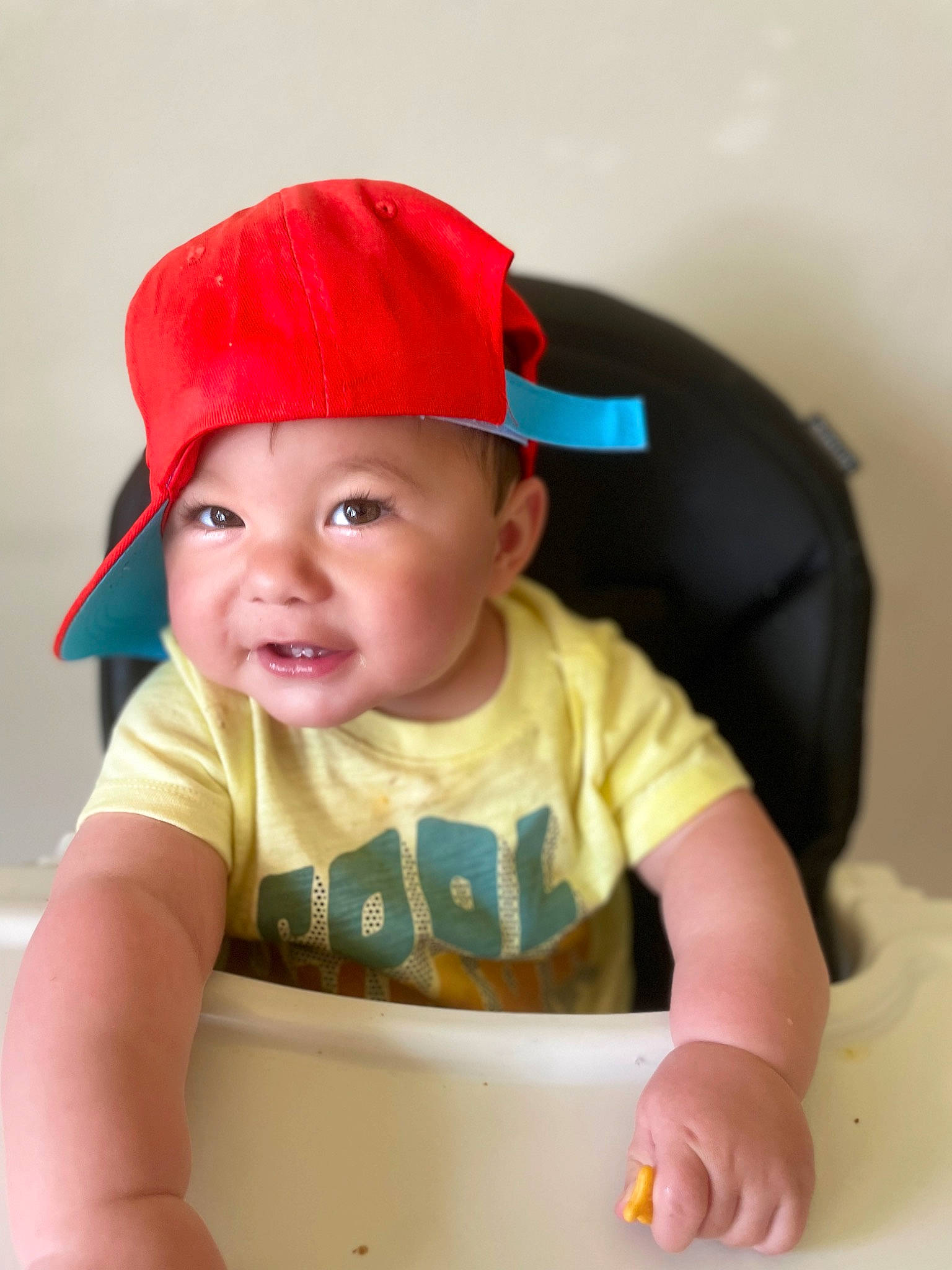 Brodie is registered to the contest to win money with this photo: baby, baby_products, baby_toddler_clothing, baseball_cap, cap, carmine, cheek, child, chin, costume_hat, fashion_accessory, fun, happy, hat, headwear, person, play, sitting, skin, sleeve