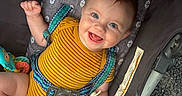 Connor joined the competition — help win amazing prizes! baby, blue_eyes, brown_hair, car_seat, child, closeup, happy, indoor, infant, joyful, pacifier, photography, portrait, safety_harness, sitting, smiling, striped_clothing, toy, vehicle, yellow_outfit