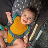 Connor joined the competition — help win amazing prizes! baby, child, infant, smiling, happy, portrait, car_seat, safety_harness, yellow_outfit, striped_clothing, pacifier, toy, blue_eyes, brown_hair, sitting, indoor, vehicle, closeup, joyful, photography