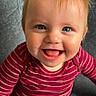 baby, blue_eyes, chair, child, close_up, cozy, face, happy, indoor, infant, laughing, open_mouth, photography, portrait, red_clothing, red_hair, seated, smiling, striped_shirt, teeth