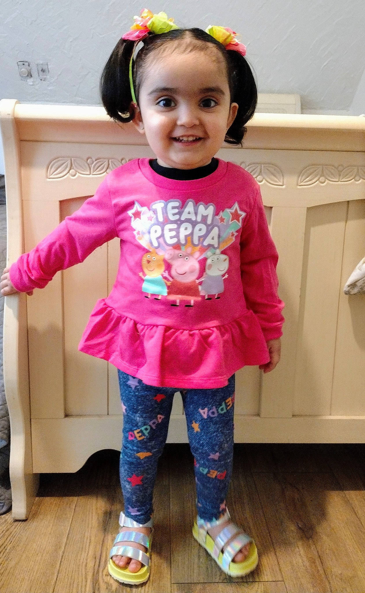 Briannalis is registered to the contest to win money with this photo: active_pants, baby_toddler_clothing, clothing, face, happy, head, human_body, joy, neck, outerwear, person, pink, product, purple, shoe, skin, sleeve, smile, standing, textile