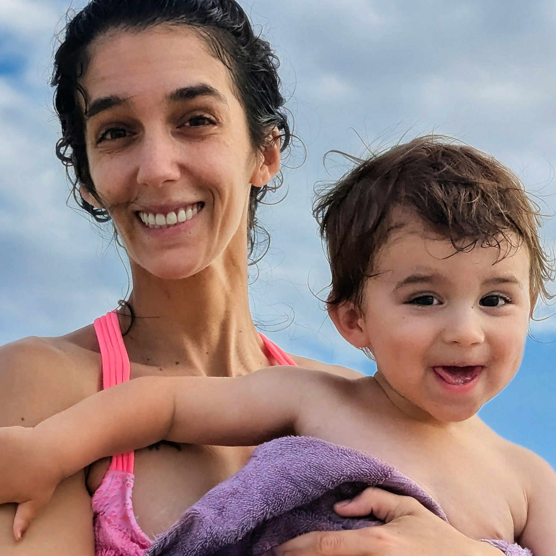 Elijah joined the competition — help win amazing prizes! bare_shoulders, child, closeup, clouds, daylight, expression, family, hair, happy, holding, outdoor, people, portrait, skin, sky, smile, summer, toddler, towel, woman