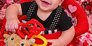 Atreus is registered to the contest to win money with this photo: baby, black_shirt, child, cute, decorations, flowers, gift, happy, hearts, indoor, person, pink, plush_toy, polka_dot, portrait, red, smiling, toy, valentines_day, walker