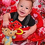Atreus is registered to the contest to win money with this photo: baby, black_shirt, child, cute, decorations, flowers, gift, happy, hearts, indoor, person, pink, plush_toy, polka_dot, portrait, red, smiling, toy, valentines_day, walker