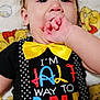 Atreus is registered to the contest to win money with this photo: baby, child, infant, face, hand, thumb_sucking, yellow_bow_tie, polka_dot_suspender, black_shirt, red_pants, blanket, winnie_the_pooh, colorful_clothing, cute, lying_down, close_up, indoors, portrait, expression, soft_toys