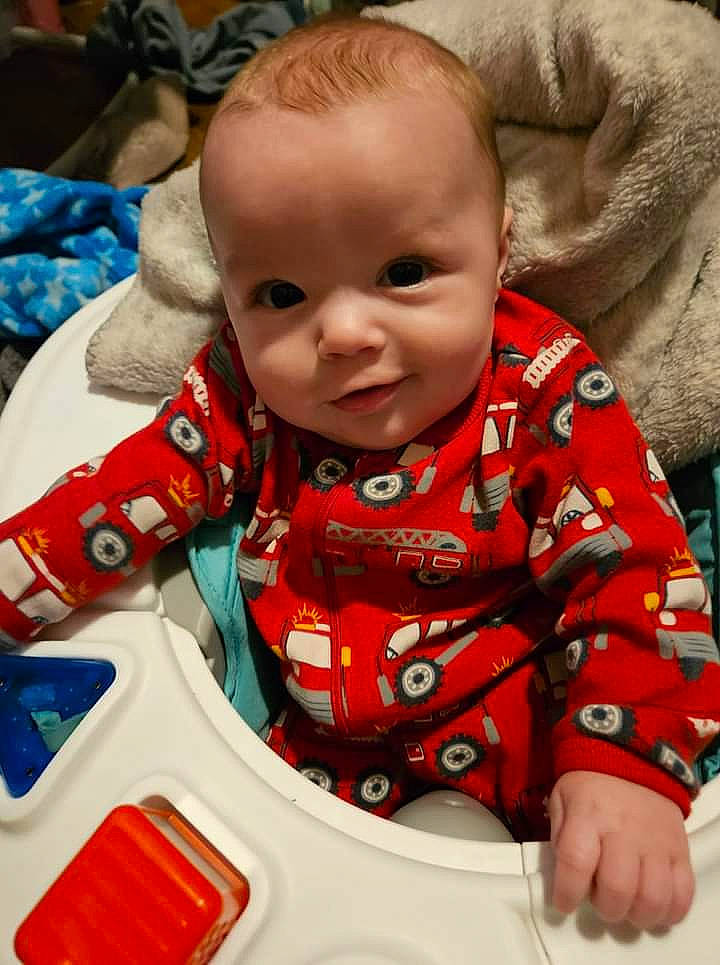 Damian is registered to the contest to win money with this photo: baby, baby_products, baby_toddler_clothing, beauty, carmine, cheek, child, comfort, event, facial_expression, fun, happy, head, pattern, person, product, sitting, skin, sleeve, toddler