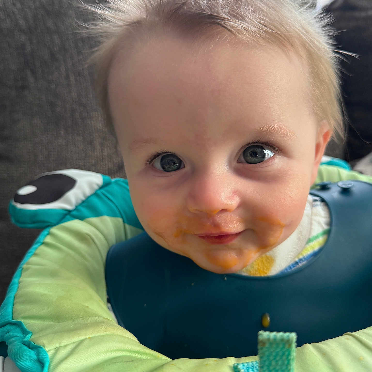 Sawyer joined the competition — help win amazing prizes! baby, bib, blonde, bodypart, couch, cream, cutlery, dessert, eating, face, finger, food, furniture, hand, head, icing, person, photography, portrait, spoon