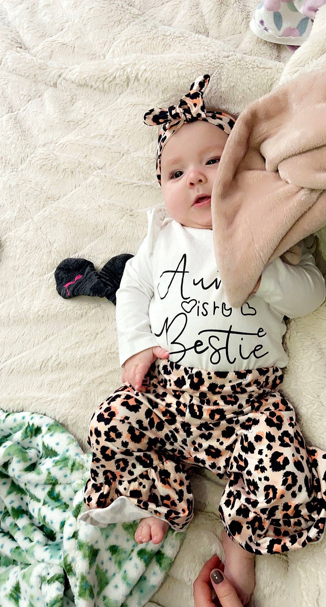 Hadlee is registered to the contest to win money with this photo: active_pants, arm, baby, baby_toddler_clothing, cool, facial_expression, fashion, finger, hairstyle, happy, headwear, human, mammal, person, pink, product, skin, sleeve, textile, toddler