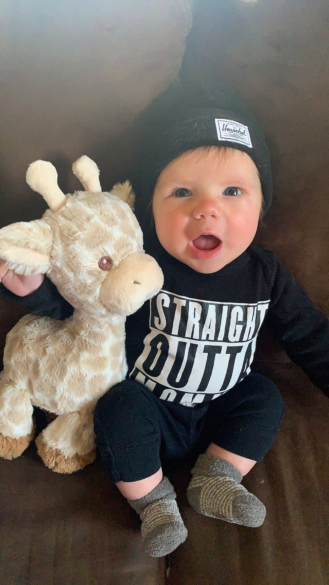 Sterling is registered to the contest to win money with this photo: baby, baby_toddler_clothing, baseball_cap, beanie, cap, child, flash_photography, fun, fur, happy, hat, headwear, person, plush, sitting, sleeve, smile, sock, stuffed_toy, t_shirt