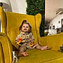 Lorenzo participe au concours pour gagner de l'argent avec cette photo : toddler, child, yellow_armchair, toy_lion, toy_giraffe, toy_zebra, safari_outfit, hat, indoor, greenery, lamp, smiling, barefoot, furniture, playful, cute, portrait, happy, room, person