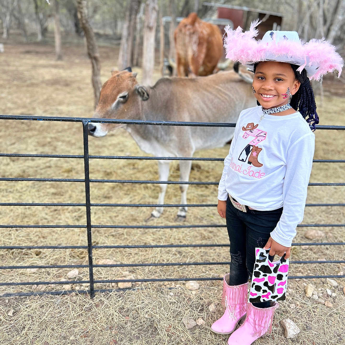 Sanai is registered to the contest to win money with this photo: animal, cattle, child, clothing, cow, dress, face, female, footwear, girl, hat, head, livestock, pants, person, photography, plant, portrait, shoe, shorts