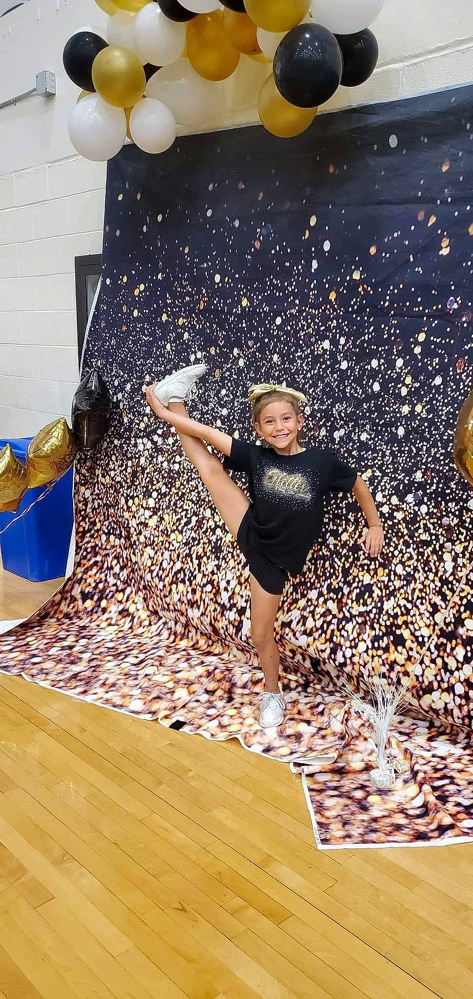 Payten is registered to the contest to win money with this photo: art, asphalt, balance, barefoot, entertainment, event, flash_photography, flooring, fun, grass, happy, hardwood, human_leg, joy, leisure, people_in_nature, performing_arts, person, recreation, t_shirt