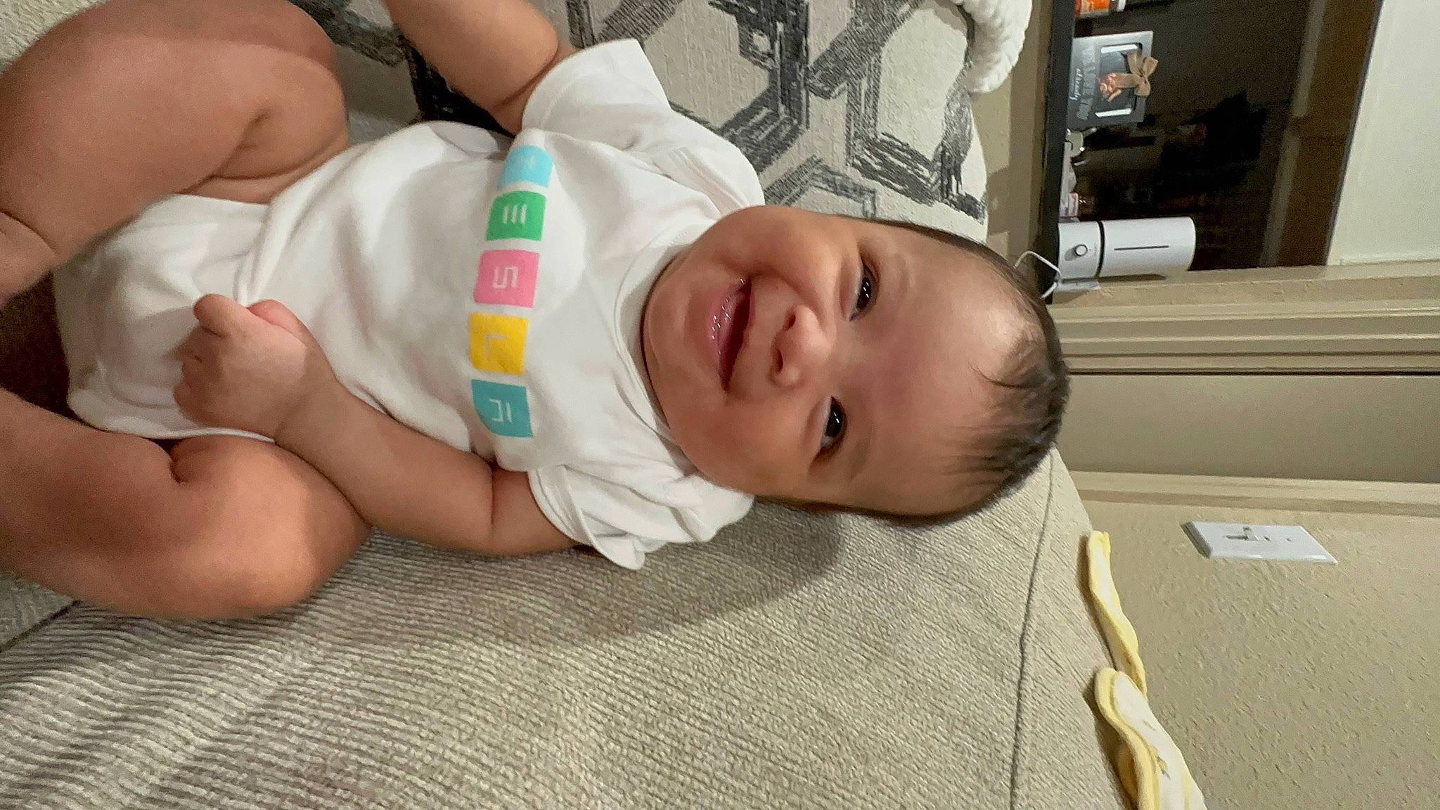 Jordyn joined the competition — help win amazing prizes! baby, baby_products, baby_toddler_clothing, cheek, chest, child, comfort, eye, eyelash, facial_expression, flooring, happy, joy, mouth, person, picture_frame, room, skin, smile, television