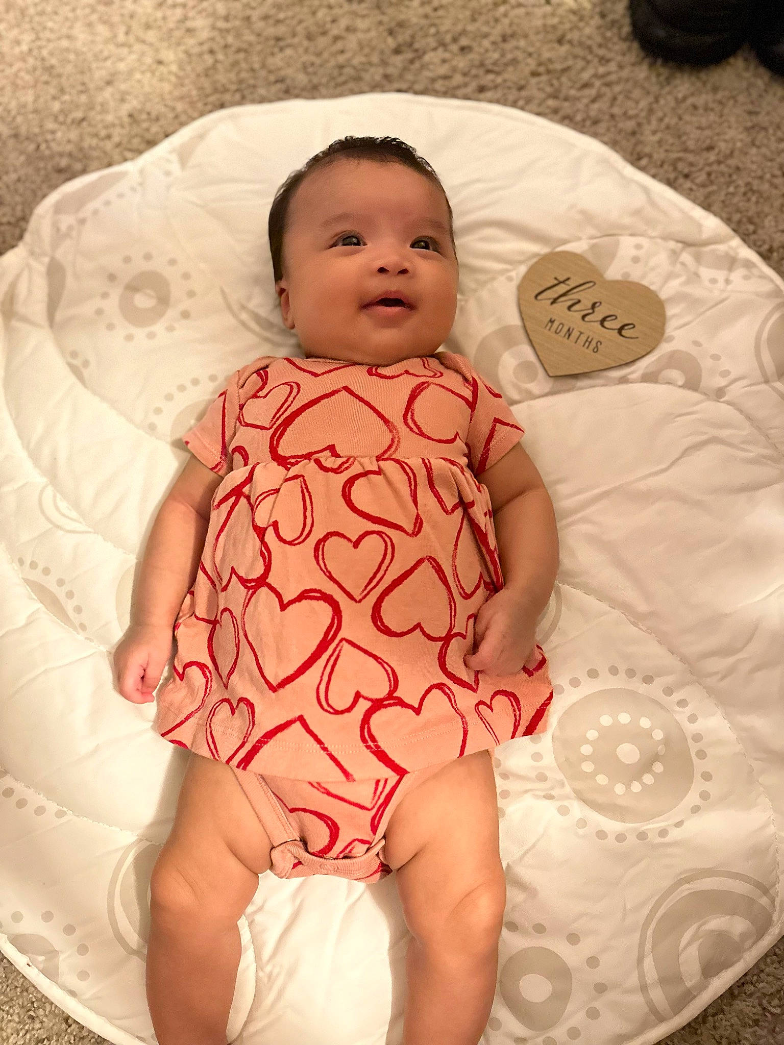 Jordyn is registered to the contest to win money with this photo: arm, baby, baby_toddler_clothing, cheek, child, comfort, dress, eye, face, facial_expression, finger, hand, head, iris, lip, person, pink, skin, sleeve, textile