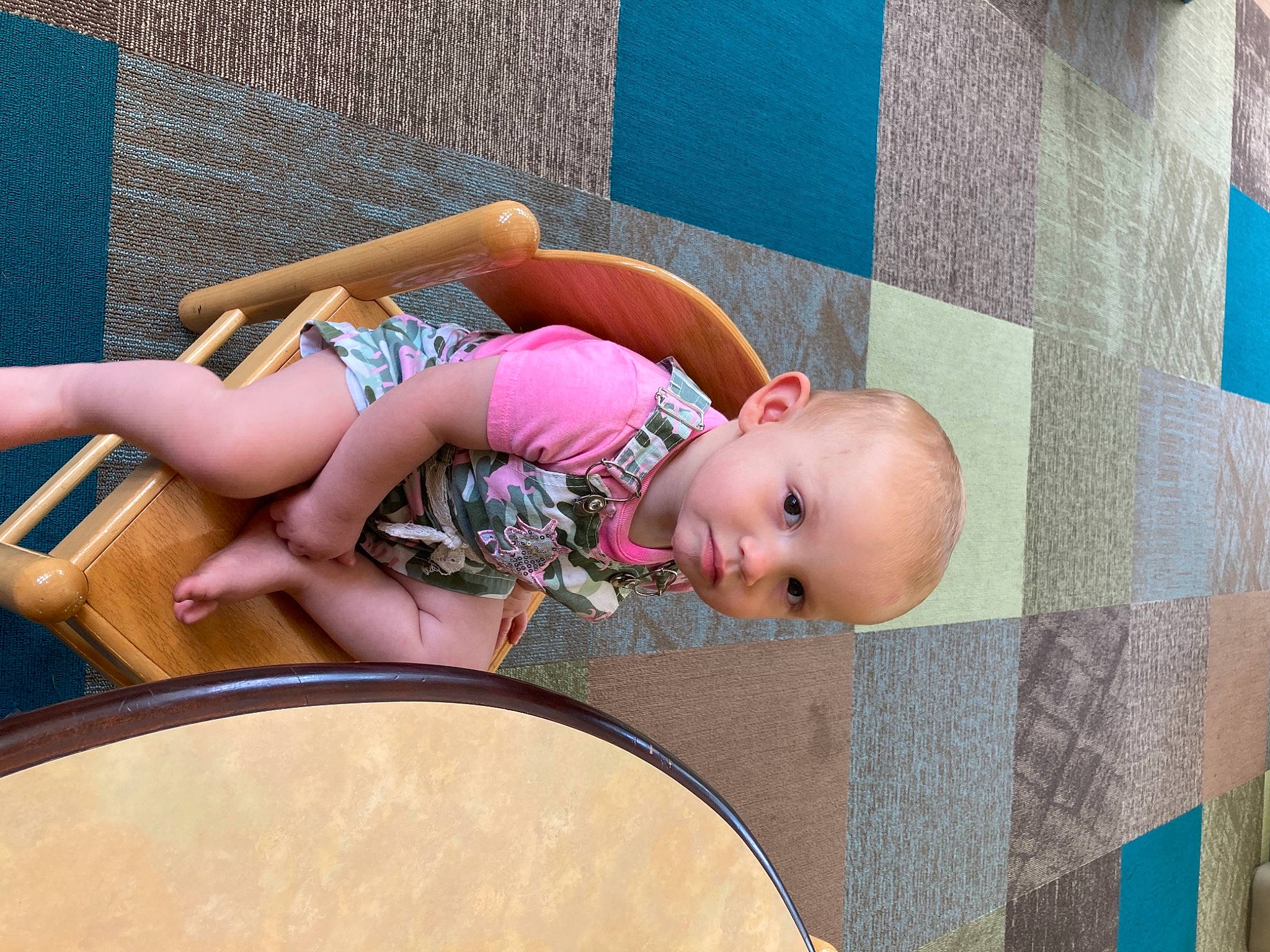 Heavenly is registered to the contest to win money with this photo: baby, barefoot, blond, blue, child, flooring, foot, fun, grass, human_leg, knee, leisure, magenta, person, pink, recreation, room, sitting, thigh, toddler
