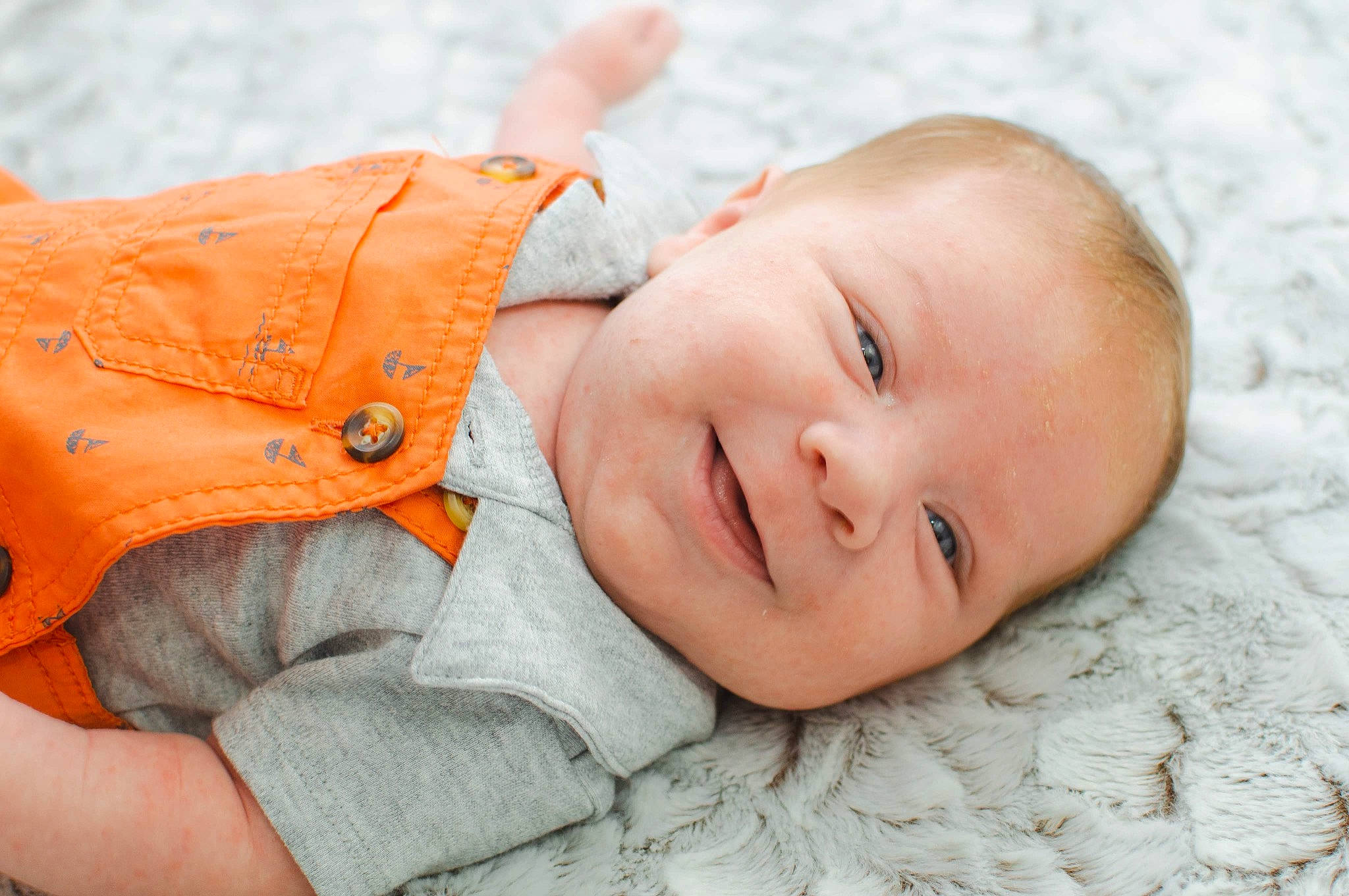 Ramses is registered to the contest to win money with this photo: baby, baby_laughing, baby_toddler_clothing, cheek, child, close_up, comfort, eye, facial_expression, grass, happy, joy, linens, lip, nose, pattern, person, portrait_photography, skin, sleeve