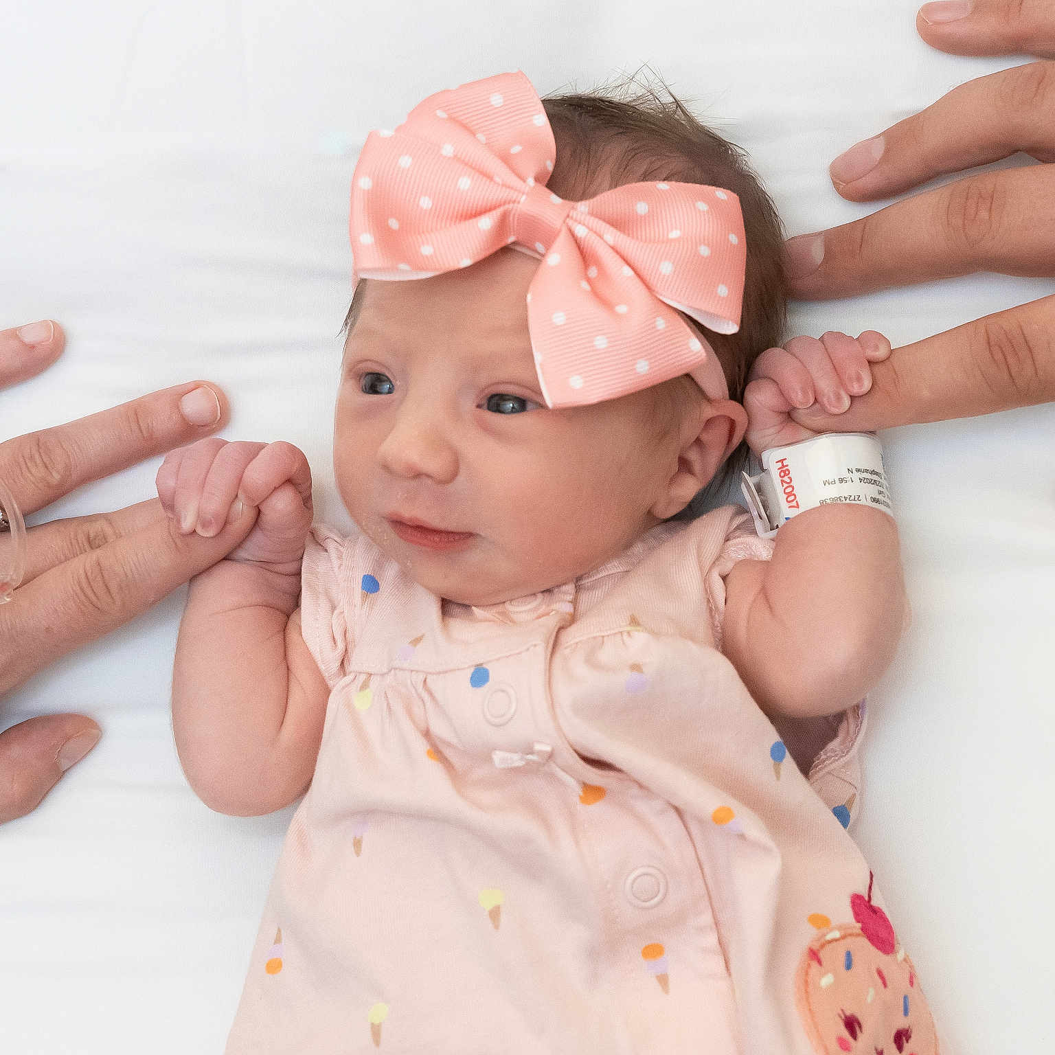 Everly is registered to the contest to win money with this photo: accessories, baby, bodypart, clothing, face, finger, formalwear, hand, happy, head, headband, jewelry, nail, newborn, person, photography, portrait, smile, tie, wrist