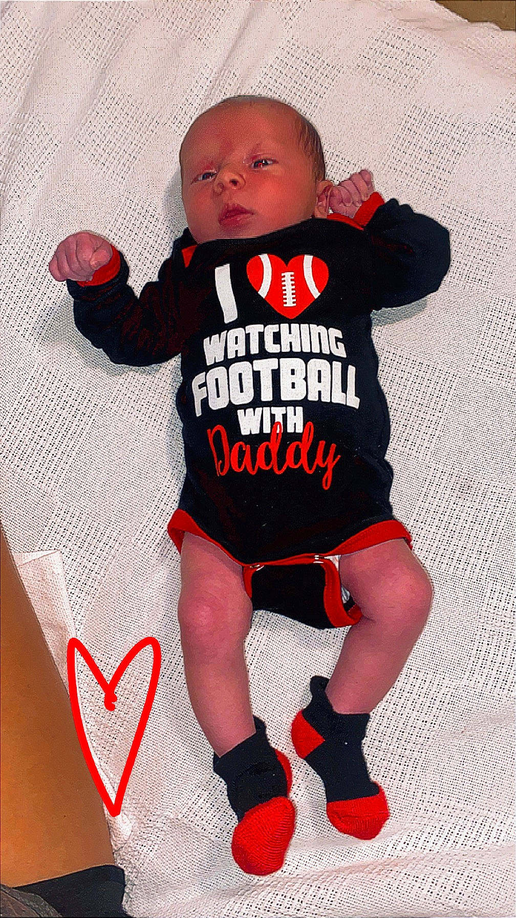 Camden is registered to the contest to win money with this photo: baby, baby_products, baby_toddler_clothing, carmine, font, happy, human_leg, jersey, knee, outerwear, pattern, person, product, shorts, sleeve, sock, sportswear, t_shirt, thigh, thumb