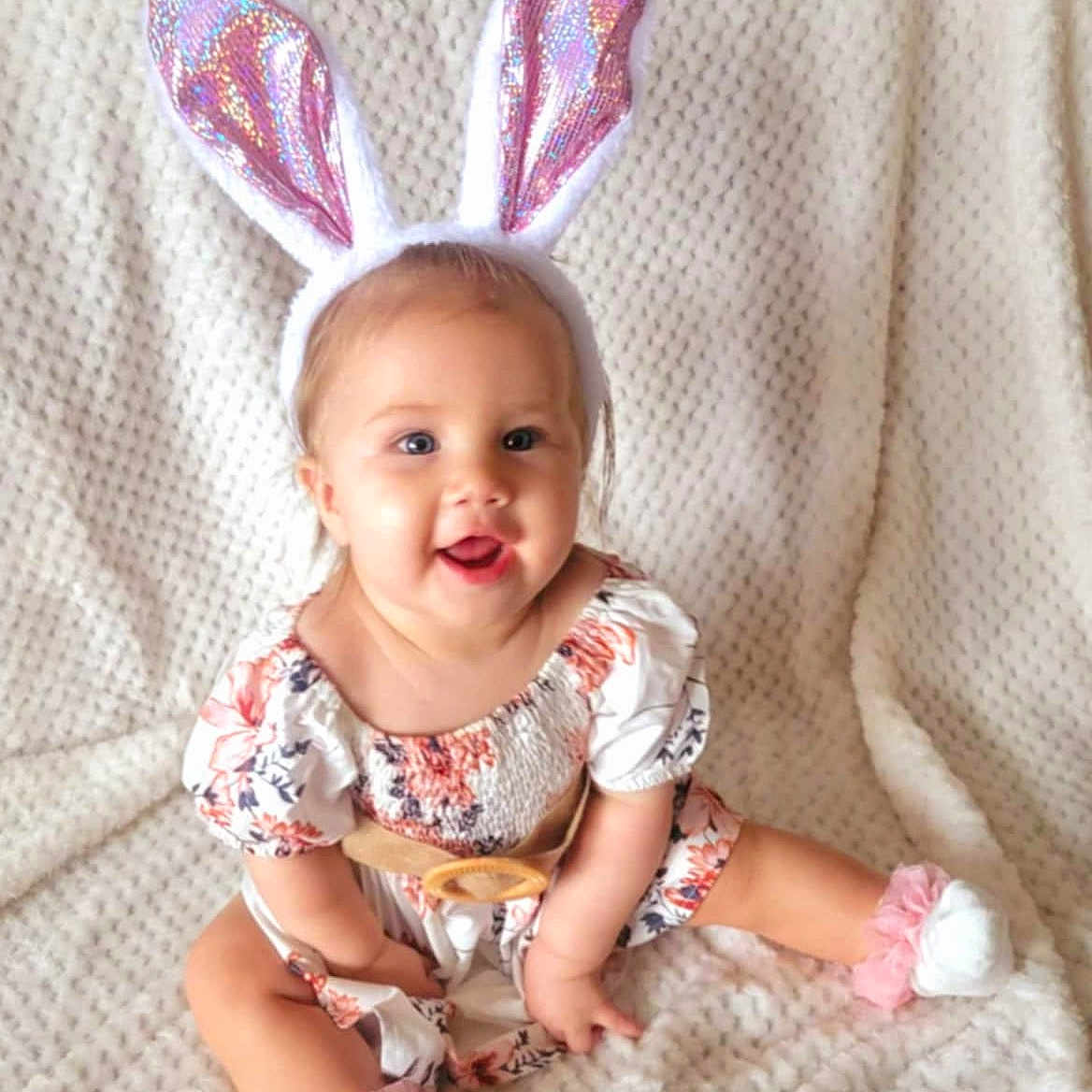 Aniya joined the competition — help win amazing prizes! accessories, baby, balloon, clothing, costume, cushion, dress, face, happy, hat, head, homedecor, indoors, laughing, person, photography, portrait, purple, sitting, smile