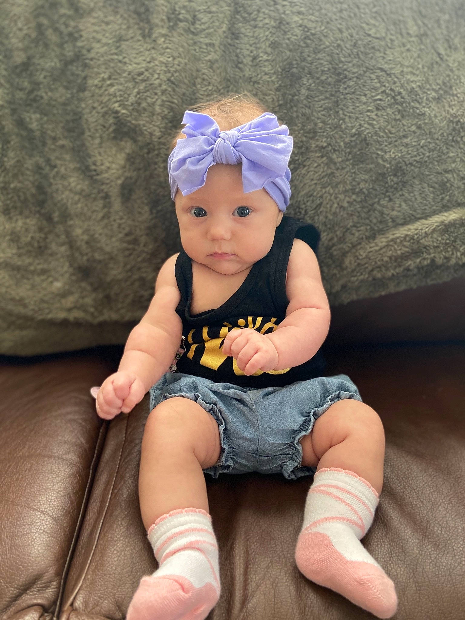 Vivian is registered to the contest to win money with this photo: baby, baby_toddler_clothing, cap, comfort, costume_hat, electric_blue, fashion_accessory, flash_photography, foot, happy, hat, head, headpiece, headwear, human_leg, knee, leg, person, sitting, sleeve