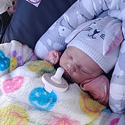 Alina joined the competition — help win amazing prizes! baby, sleeping, blanket, hat, pacifier, car_seat, child, cute, cozy, infant, smiley_face, soft, toddler, resting, warm, comfort, clothing, face, headwear, indoors