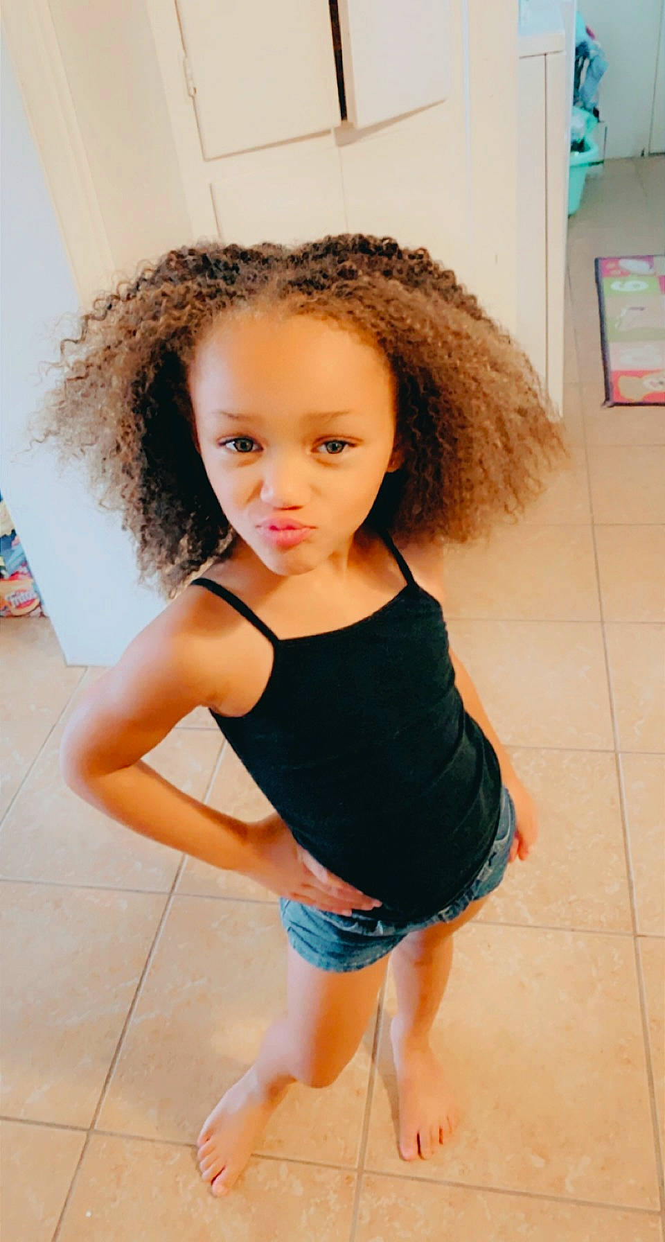 Maleah is registered to the contest to win money with this photo: arm, cheek, chin, dress, eye, eyelash, face, flash_photography, floor, hair, hairstyle, head, iris, joint, lip, neck, organ, person, skin, standing