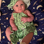 Harper joined the competition — help win amazing prizes! baby, infant, child, dinosaur_outfit, green_clothing, hat, blanket, stars, moon, pattern, lying_down, cute, smiling, portrait, footwear, soft_lighting, indoor, playful, adorable, person