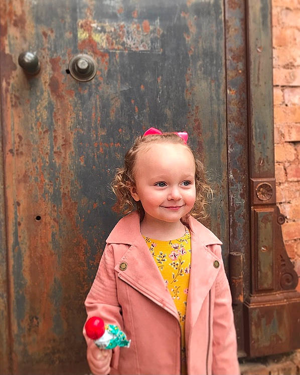 Hadlee is registered to the contest to win money with this photo: baby, cheek, child, chin, door, eye, face, fun, happy, jewellery, joy, magenta, necklace, peach, person, photograph, pink, red, skin, smile