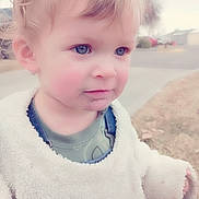 Jerrichai is registered to the contest to win money with this photo: applique, baby, blonde, bodypart, clothing, coat, ear, face, finger, fleece, frown, hair, hand, happy, head, hood, hoodie, knitwear, longsleeve, mouth