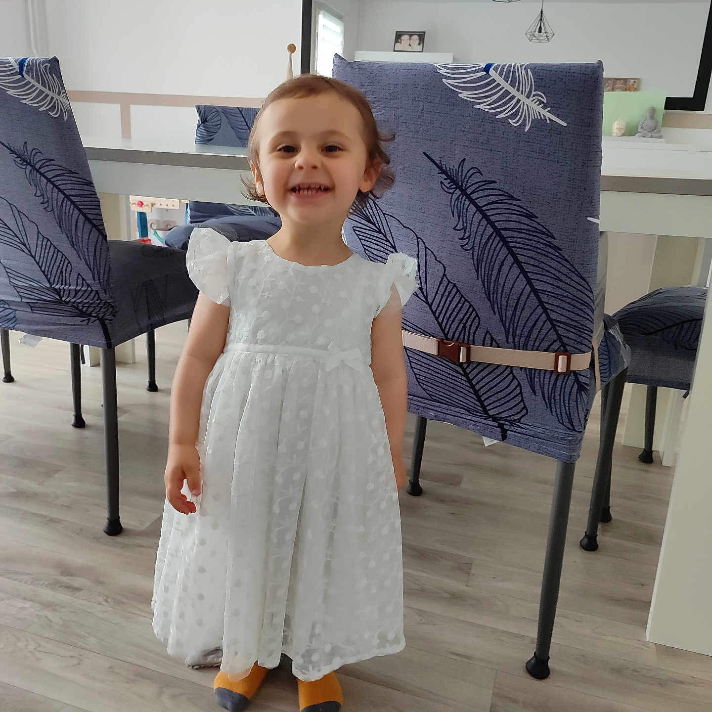 Lucie participe au concours pour gagner de l'argent avec cette photo : architecture, child, clothing, diningtable, dress, eveningdress, face, female, formalwear, furniture, girl, hardwood, head, indoors, interiordesign, person, photography, portrait, table, wood