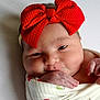 Chevelle is registered to the contest to win money with this photo: adorable, baby, blanket, child, closeup, cute, face, hand, headband, indoors, infant, newborn, newborn_baby, portrait, red_bow, resting, skin, sleepy, soft, wrapped