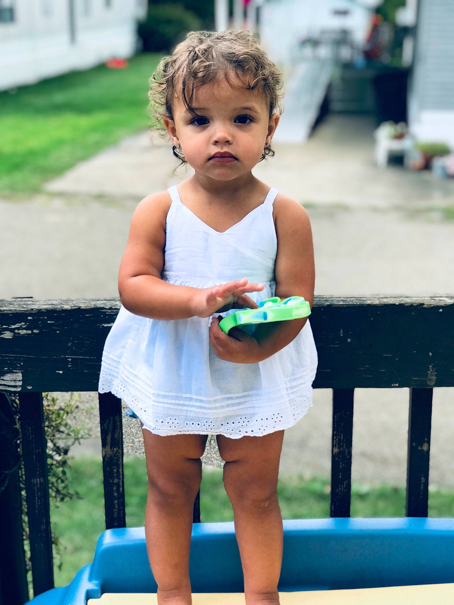 Aliza is registered to the contest to win money with this photo: azure, face, fashion, fun, grass, hairstyle, happy, joint, leisure, people, person, photograph, public_space, shorts, smile, standing, summer, thigh, toddler, waist