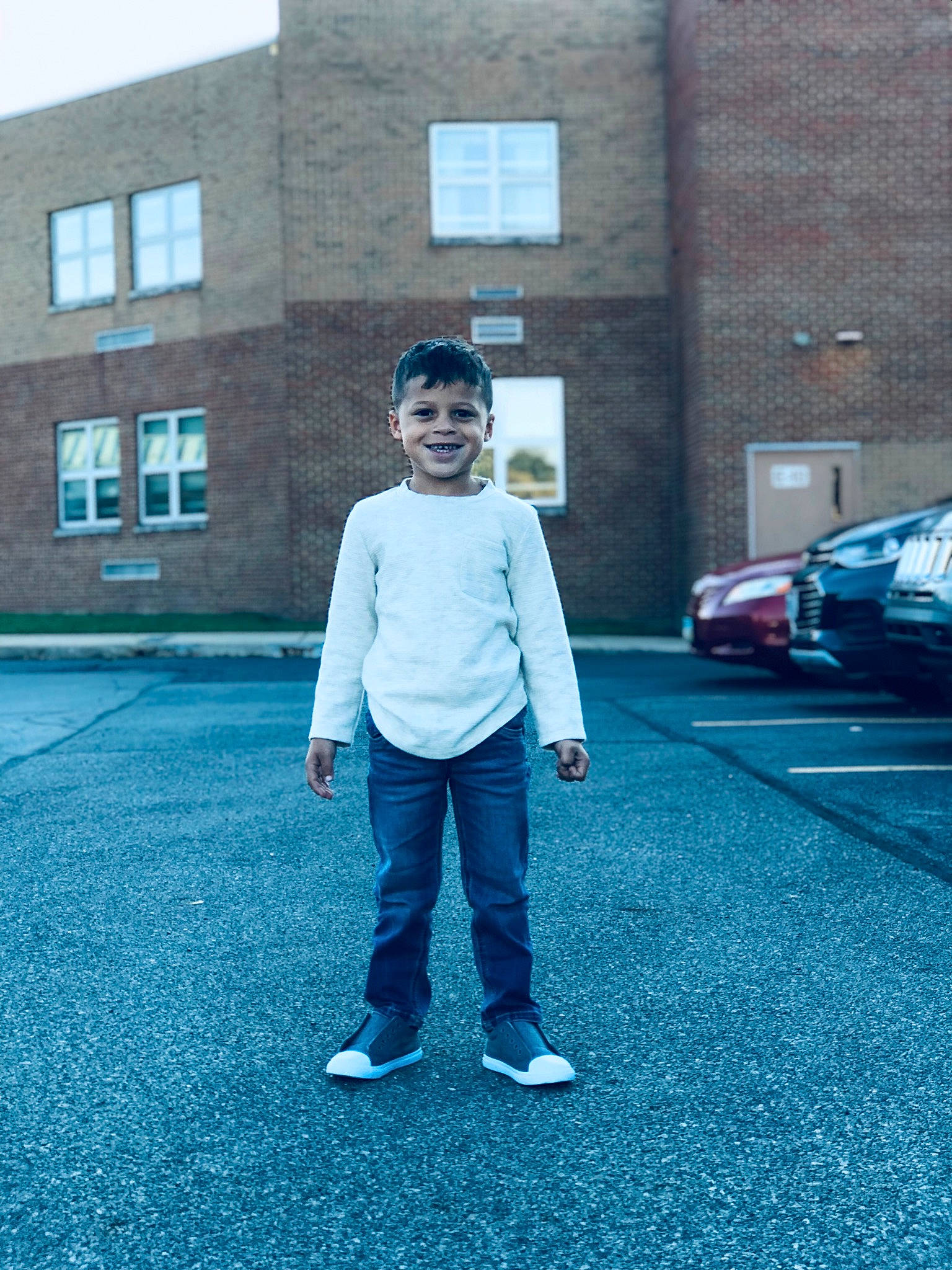 Dominic is registered to the contest to win money with this photo: asphalt, azure, blue, building, cool, denim, electric_blue, flooring, grass, joy, leisure, person, recreation, road, road_surface, sidewalk, street_fashion, t_shirt, tints_and_shades, wall