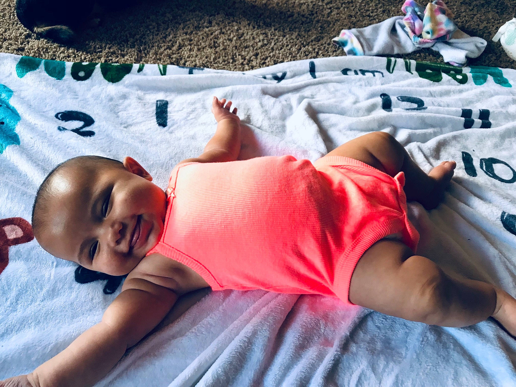 Amaya joined the competition — help win amazing prizes! abdomen, baby, baby_toddler_clothing, bedding, child, comfort, elbow, fun, hat, human_leg, joy, knee, leisure, linens, mouth, person, room, summer, textile, thigh
