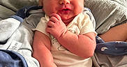Brooks joined the competition — help win amazing prizes! baby, infant, newborn, blanket, clothing, sleeping, face, hand, legs, soft, cute, cozy, resting, person, indoors, comfort, skin, expression, pose, bed
