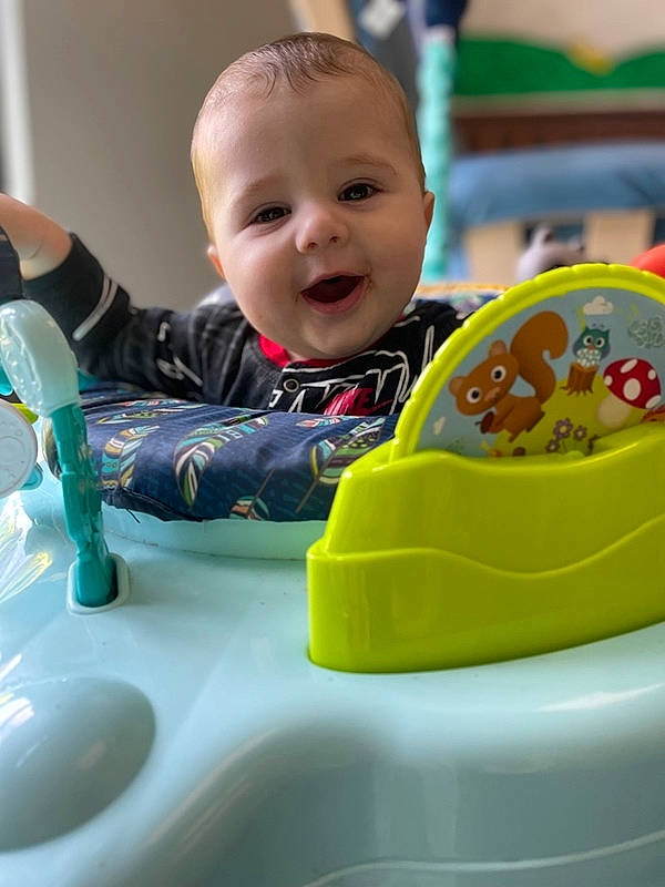 Jaxen joined the competition — help win amazing prizes! baby, baby_playing_with_toys, baby_products, baby_toddler_clothing, baby_toys, child, facial_expression, fun, green, happy, laugh, leisure, person, plastic, play, recreation, room, sitting, smile, tap