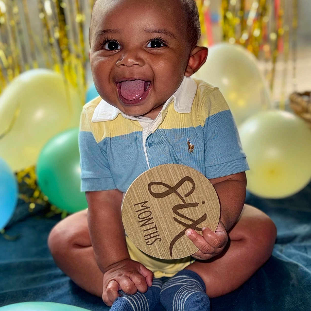 Levi is registered to the contest to win money with this photo: baby, babylaughing, balloon, bodypart, clothing, face, happy, head, hosiery, laughing, mouth, pants, person, photography, portrait, shorts, sitting, smile, sock, t_shirt