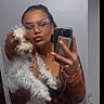 Draco joined the competition — help win amazing prizes! person, dog, mirror, selfie, glasses, phone, brown_hair, curly_fur, white_fur, pout, casual_clothing, indoor, hand, face, reflection, mobile_phone, holding, cute, pet, affection